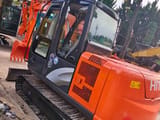 2024 Hitachi ZX60 mini excavator, rear three-quarter view