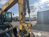 2014 Caterpillar M313D wheel excavator boom and attachment close-up