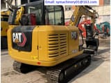 2023 Caterpillar 305.5E2 mini excavator, rear three-quarter view