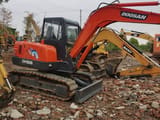 Doosan DH55 crawler excavator, side view