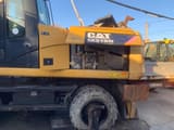 2011 Caterpillar M318D wheel excavator side view