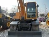 2022 Hyundai R150W-9S wheel excavator, front view with blade