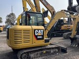 Caterpillar 306E2 mini excavator, rear three-quarter view