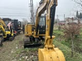 Caterpillar 306 Mini Excavator, front three-quarter view