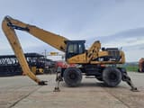 2009 Caterpillar M325D LMH material handler, side profile view