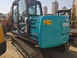 Kobelco SK75 Super mini excavator, rear three-quarter view