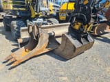 2014 Wacker Neuson EW100 wheel excavator front view with attachments