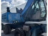 2010 Fuchs MHL320 material handler, side view
