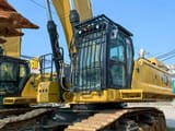 2022 Caterpillar 395 crawler excavator, side view