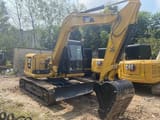 2024 Caterpillar 308E2 mini excavator, front three-quarter view