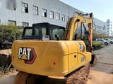 2024 Caterpillar 313GC crawler excavator, rear three-quarter view