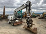 2009 Caterpillar M316D wheel excavator, front three-quarter view