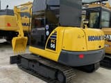 2023 Komatsu PC56-7 mini excavator, rear three-quarter view