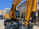 2022 Hyundai R210W-9 wheel excavator, front three-quarter view
