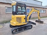 2022 Caterpillar 302.7 mini excavator, rear three-quarter view