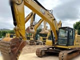 2023 Caterpillar 320 crawler excavator, front three-quarter view