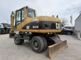 2006 Caterpillar M313C wheel excavator, rear three-quarter view