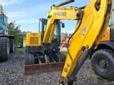 2018 New Holland E60C crawler excavator, front three-quarter view