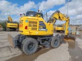 2023 Komatsu PW138MR-11E0 wheel excavator, rear three-quarter view