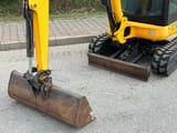 2012 JCB 8018 CTS mini excavator front view with bucket and blade