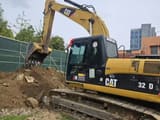 2012 Caterpillar 323DL crawler excavator side view