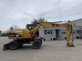 2006 Caterpillar M313C wheel excavator, side view