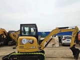 2023 Caterpillar 303.5E2 mini excavator, side profile view