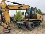 2012 Caterpillar M322D wheel excavator side view