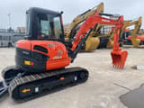 2022 Kubota U55-4 mini excavator, rear three-quarter view