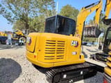 2025 Caterpillar 306 mini excavator rear three-quarter view