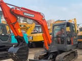 2019 Doosan DX55 crawler excavator, front three-quarter view