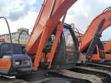 2023 Hitachi ZX200 crawler excavator, side view of cab and boom