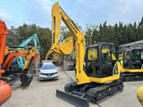 2022 Komatsu PC56-7 mini excavator, three-quarter view