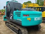 2022 Kobelco SK140LC crawler excavator, rear three-quarter view