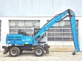 Manipulador de materiais Fuchs MHL320D de 2016, vista de perfil lateral