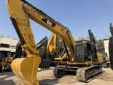 2025 Caterpillar 330DL crawler excavator, front three-quarter view