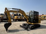 2023 Caterpillar 305.5E mini excavator, side profile view