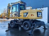 2012 Caterpillar M313D wheel excavator, rear three-quarter view