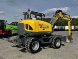 2016 Wacker Neuson EW100 wheel excavator, rear three-quarter view