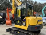 2023 Komatsu PC56-7 mini excavator, rear three-quarter view