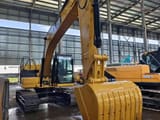 2023 Caterpillar 320GC crawler excavator, front three-quarter view
