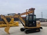 2022 Caterpillar 305.5E2 mini excavator, side profile view