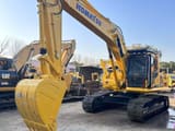 2023 Komatsu PC220 crawler excavator, front three-quarter view