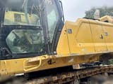 2021 Caterpillar 395 crawler excavator side view of cab