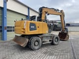 2015 Liebherr A918 wheel excavator, rear three-quarter view