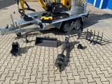 Berger Kraus BK1000JS mini excavator on trailer with attachments