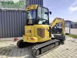 2023 Caterpillar 303.5CR mini excavator, rear three-quarter view
