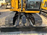 2025 Caterpillar 307C mini excavator front view with blade