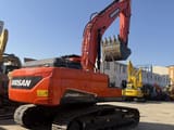 2024 Doosan DX225LCA crawler excavator, rear three-quarter view