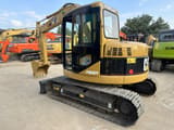 2024 Caterpillar 308C excavator, rear three-quarter view